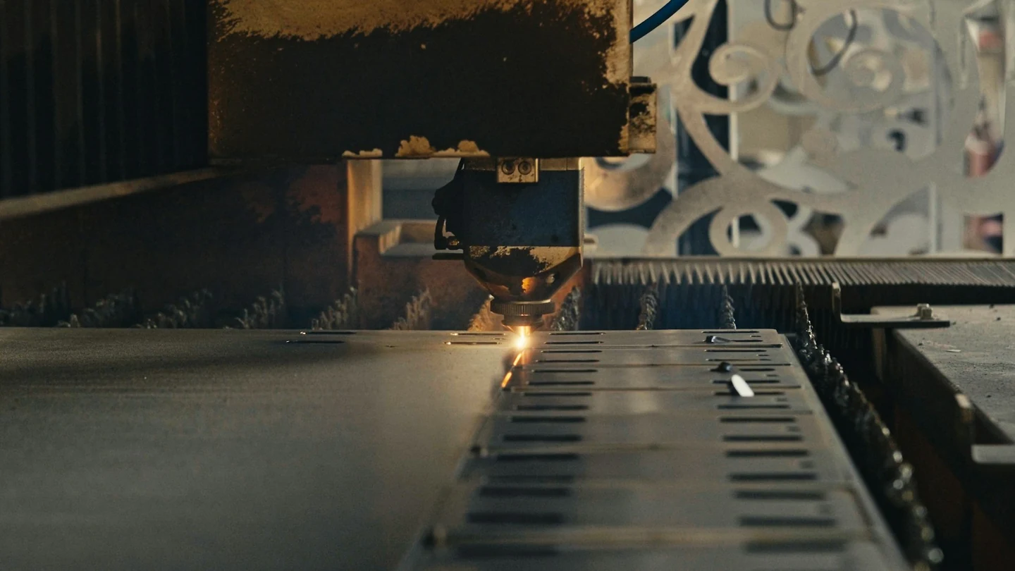 Illustrative view of laser cutting of a metal sheet on an industrial machine